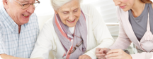 elderly people with their caregiver